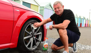 Auto Express special contributor Steve Sutcliffe cleaning the Audi TT&#039;s damaged wheel